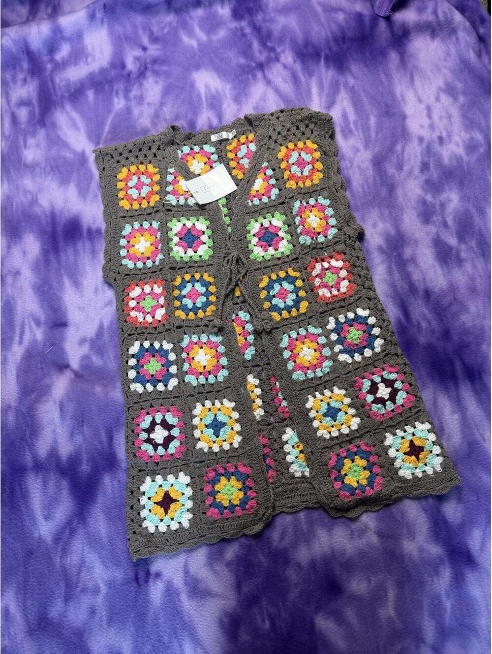 Tamsy gray crochet vest with multicolored granny square pattern.